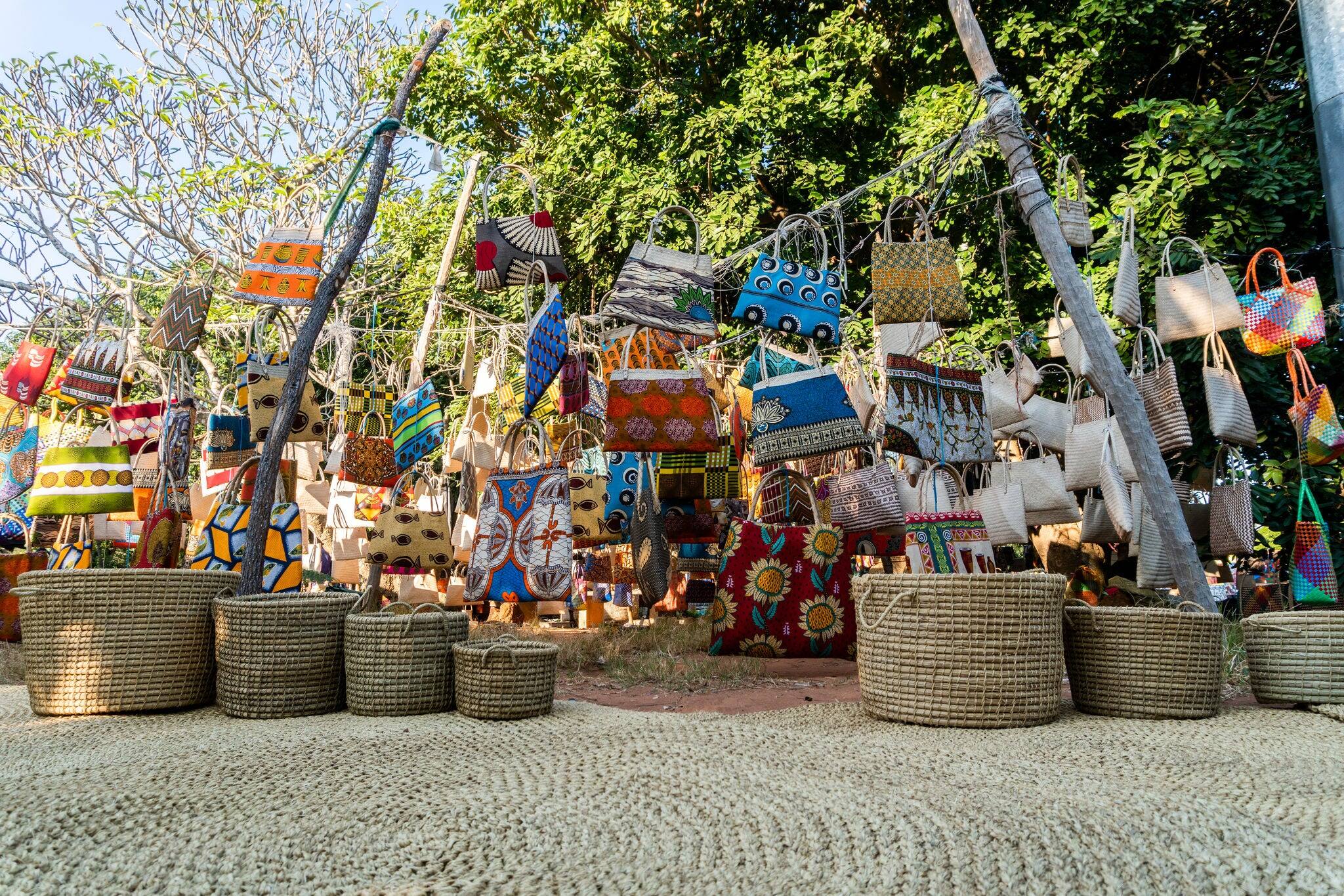 Traditional african market selling colorful  bags hanged on trees, FEIMA, Maputo, Mozambique