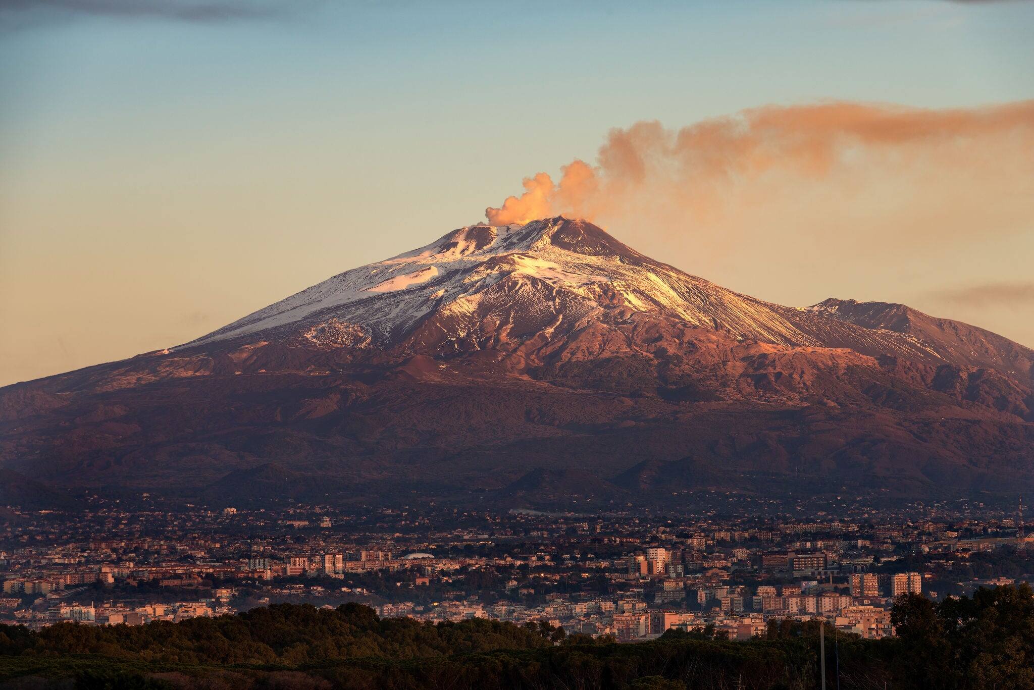 The mount Etna Volcano with smoke and the Catania city, Sicily island, Italy (Sicilia, Italia)