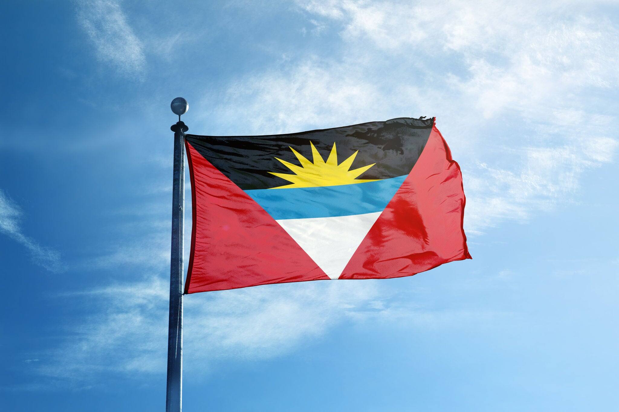 Flag of  Antigua and Barbuda on the mast
