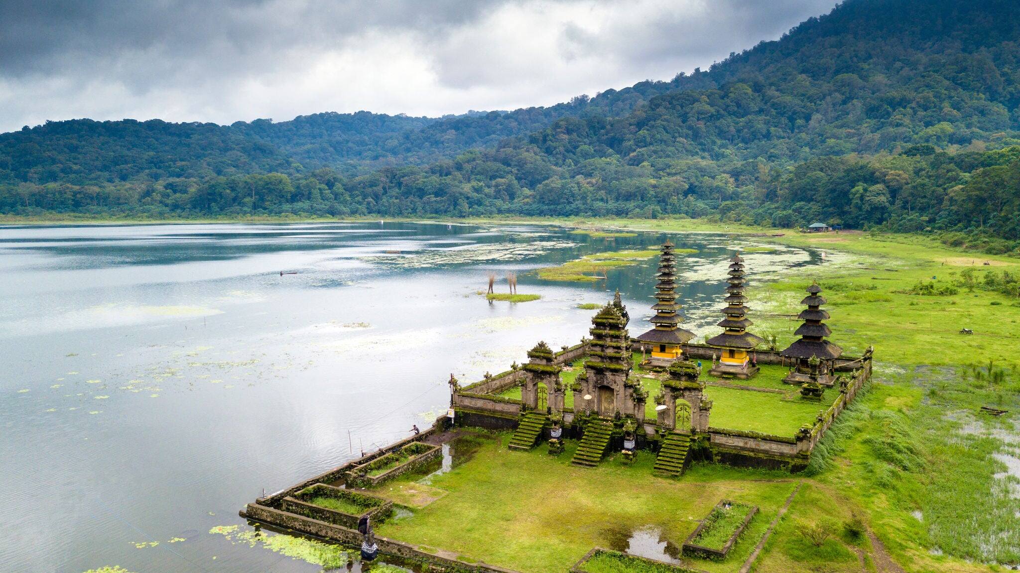 Aerial view of hindu temple ruins of Pura Hulun Danu at the Tamblingan lake, Bali, Indonesia