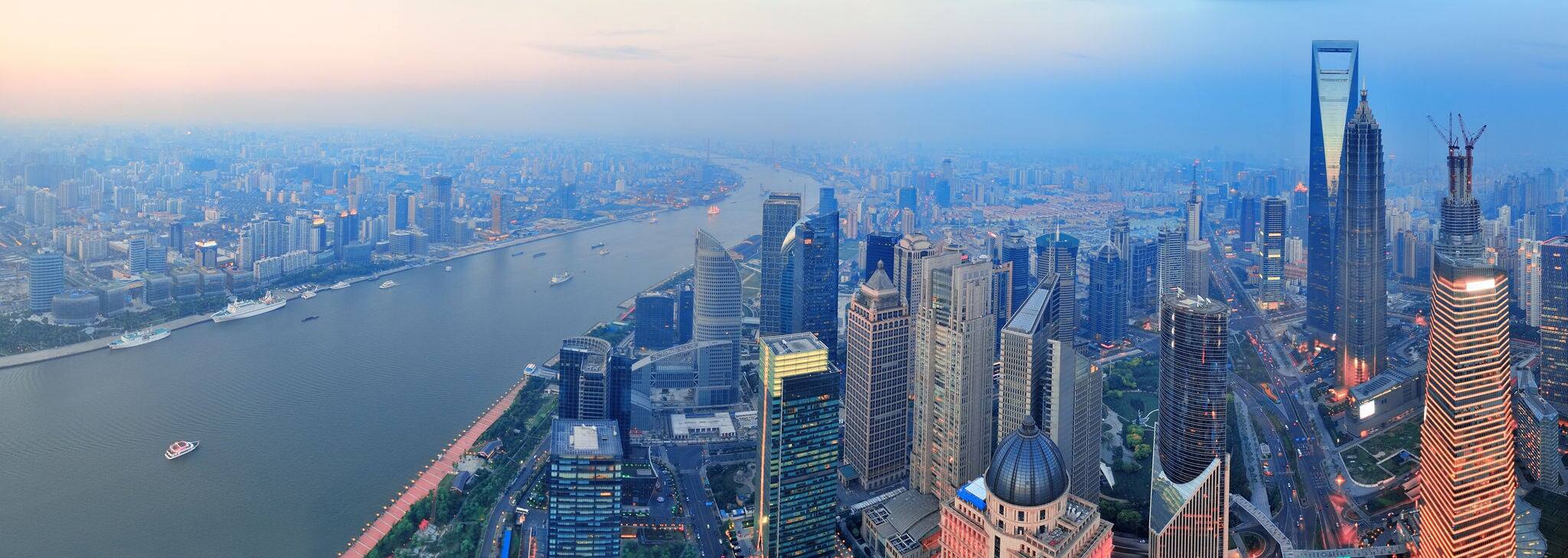 Shanghai aerial view with urban architecture and sunset panorama