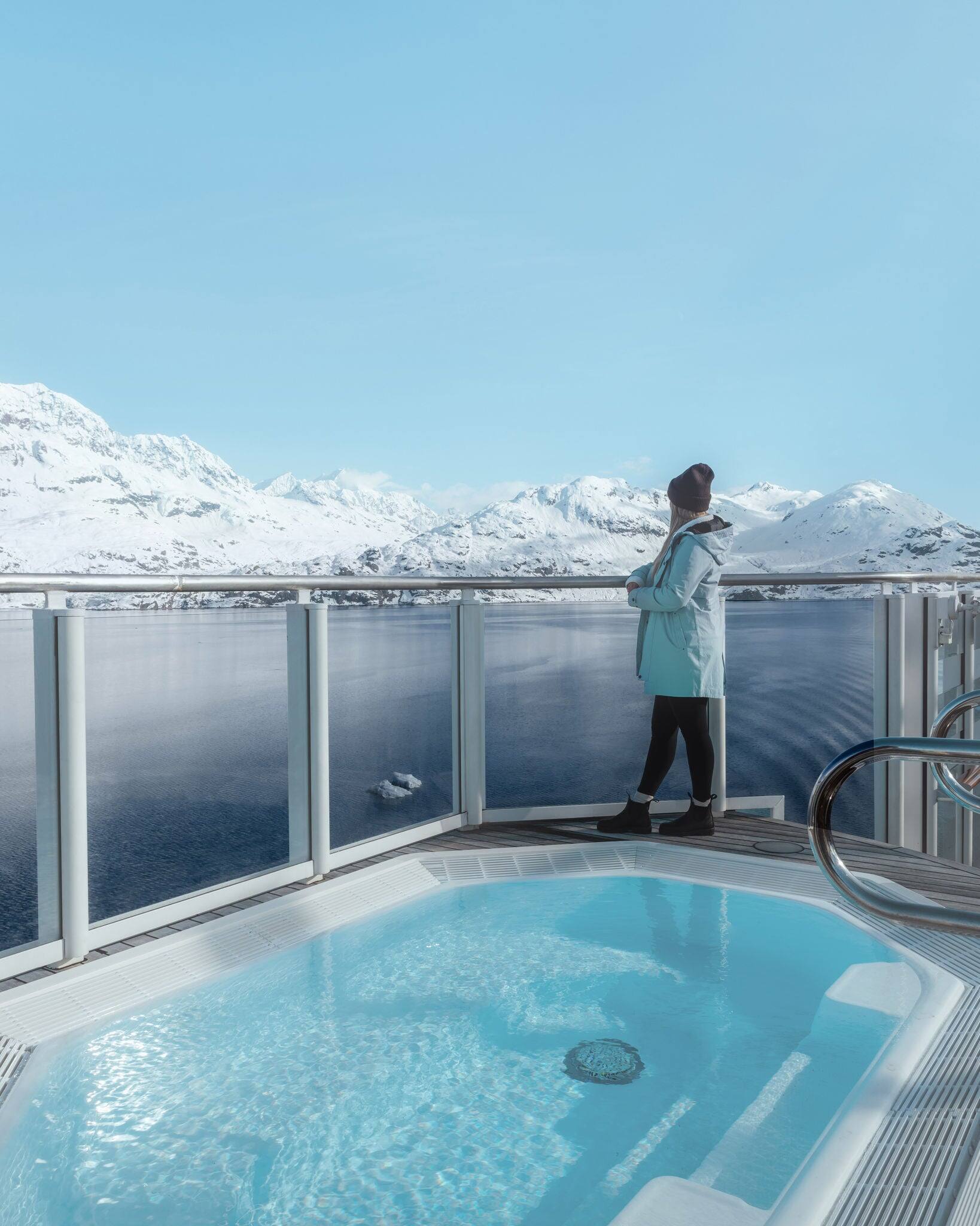 Woman looking at glaciers in Alaska.