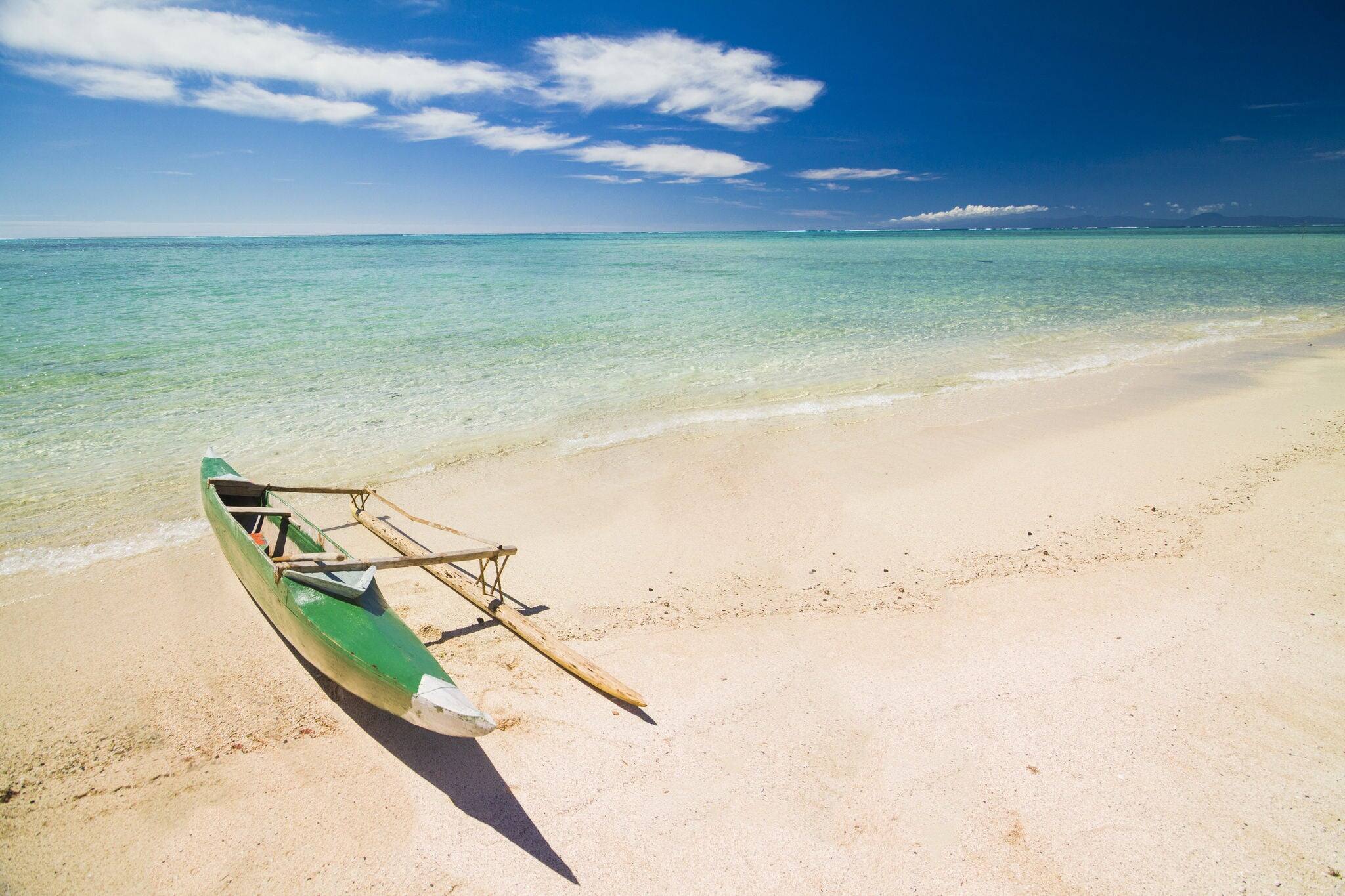 Va'a samoa canoe or a boat on the beach with clear sky
