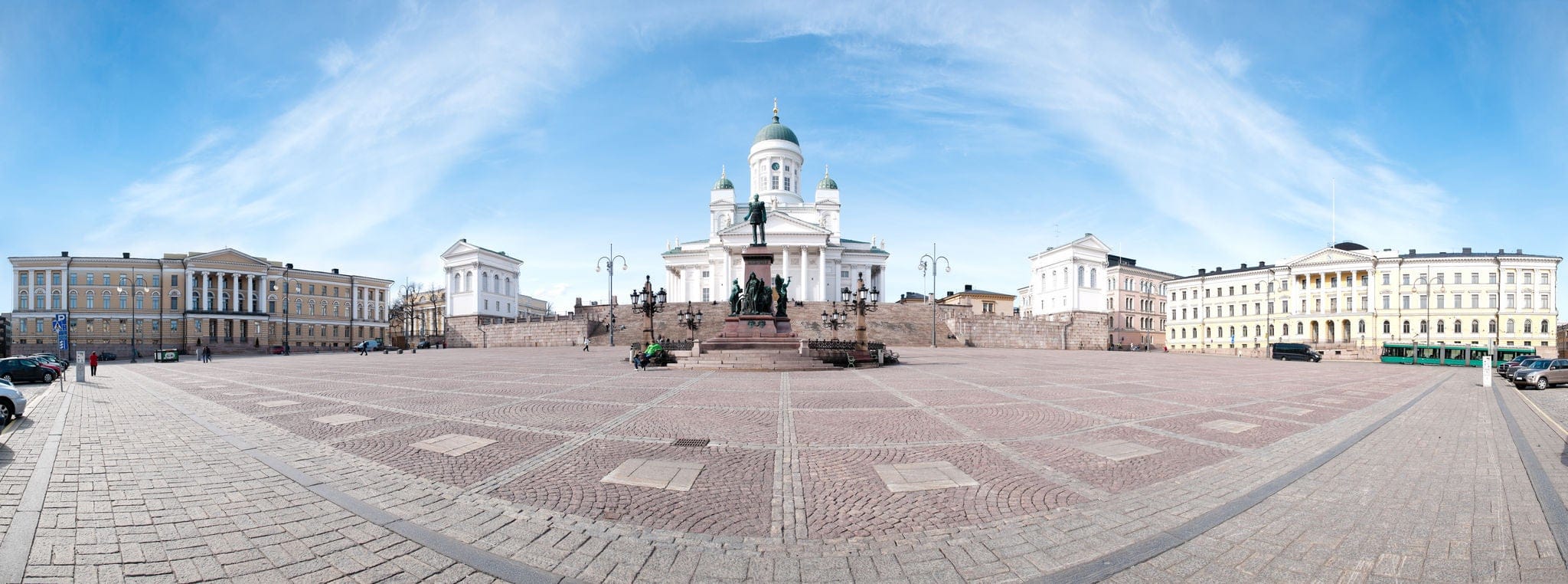 panorama view of the Helsinki cathedral square with blue cloudy sky in background