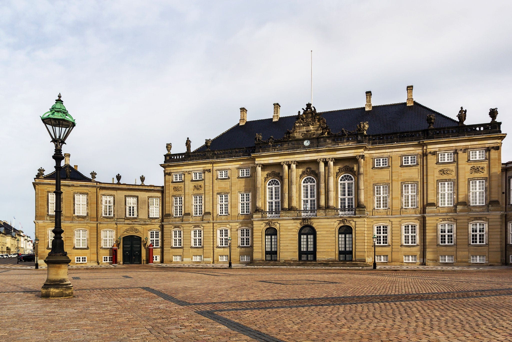 Amalienborg is the winter home of the Danish royal family, and is located in Copenhagen, Denmark.