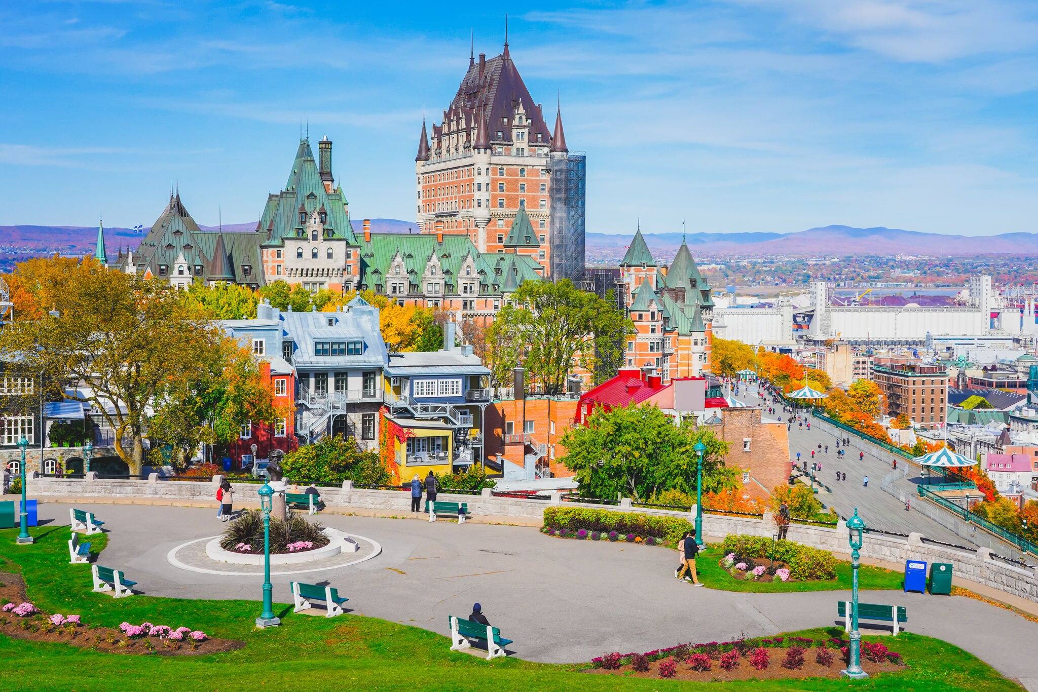 Cityscape view of Old Quebec City in Autumn, from hill close to fortification, famous viewpoint to see Chateau Frontenac, Dufferin terrace, St. Lawrence river. Beautiful landscape scene in fall season