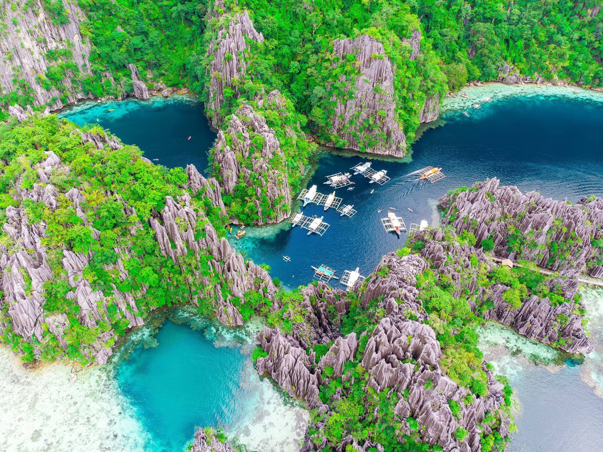 Bird's-eye view of the picturesque Twin Lagoon and limestone cliffs in Coron, Palawan, Philippines.