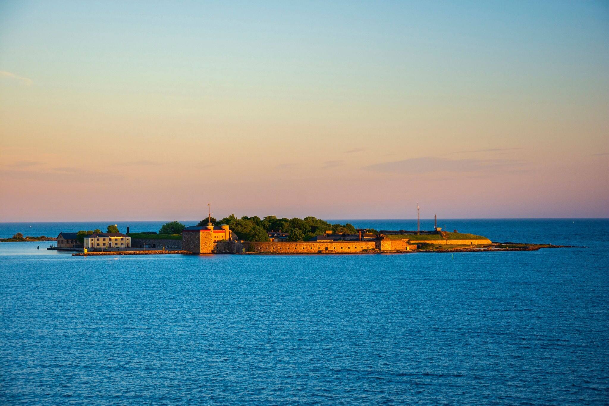 Magnificent sunset view on the island with Kungsholms Fort (coastal artillery fortress for control of Karlskrona harbour). Location place: the Baltic Sea near Karlskrona, Sweden.