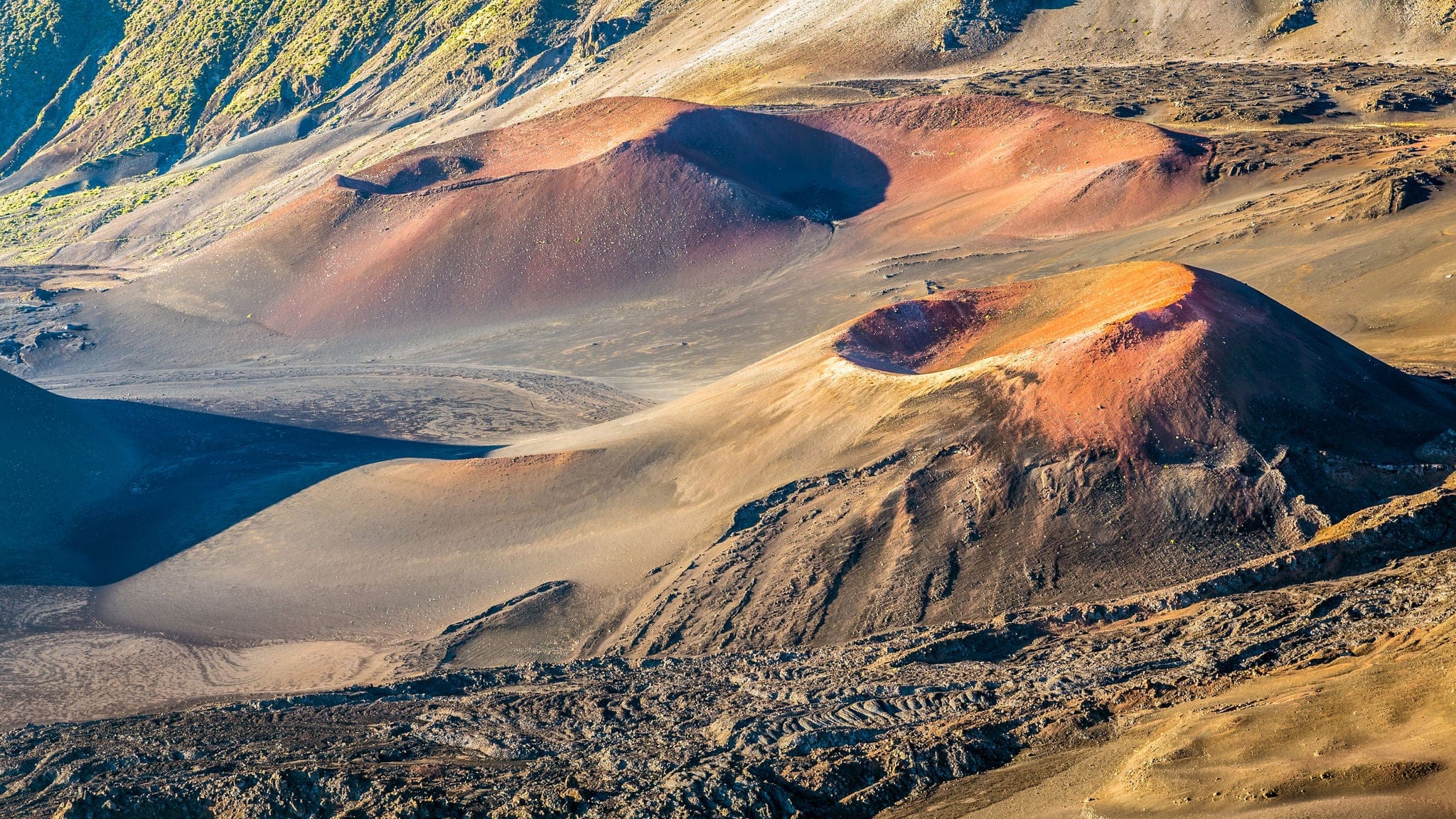Otherworldly Volcanic landscape with colorful cinder cones inside the crater at the summit of Haleakala volcano at sunrise on the island of Maui, hawaii.