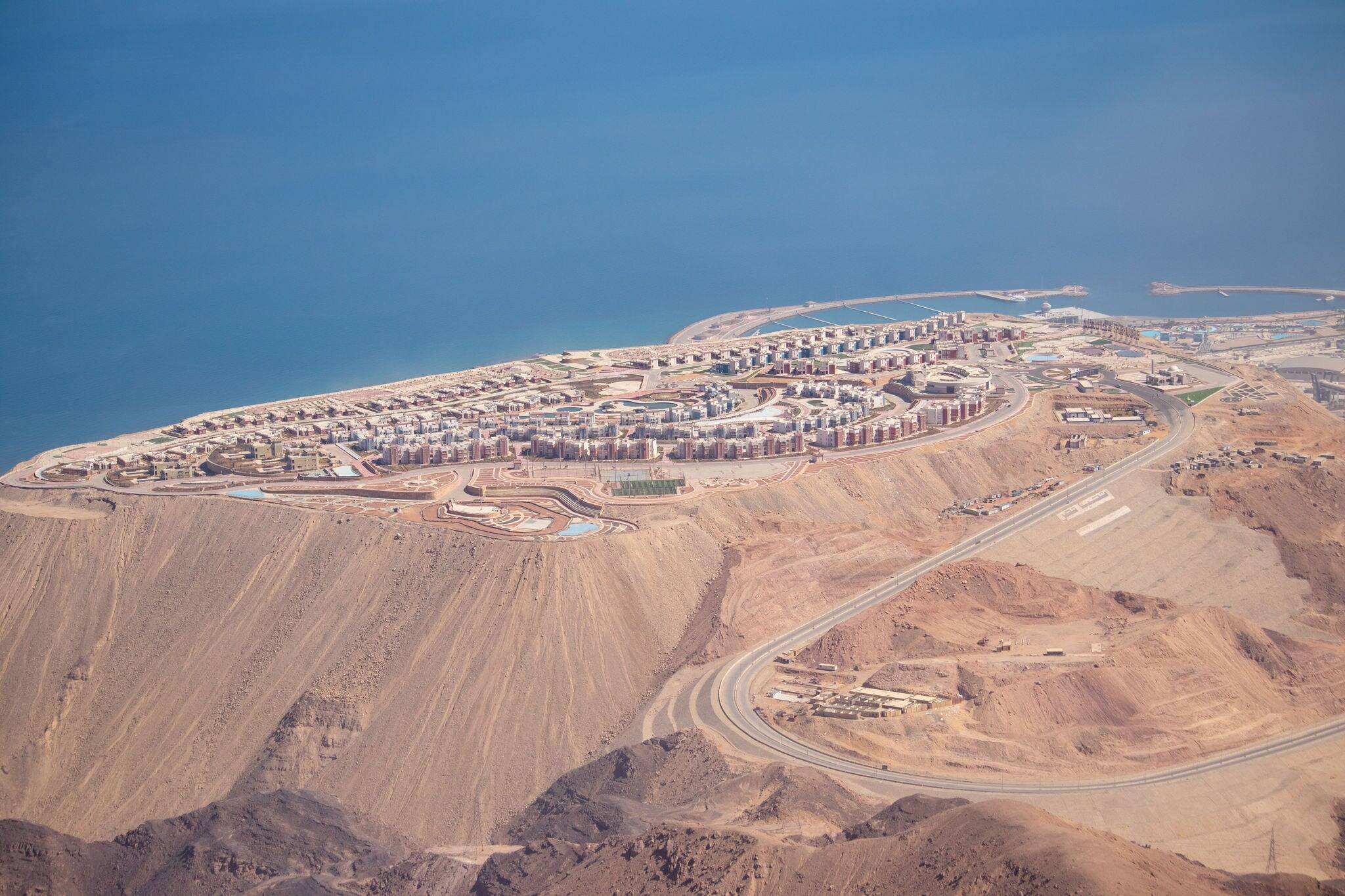 view of a new city galala built on very high mountain with back ground of skies and mountains
