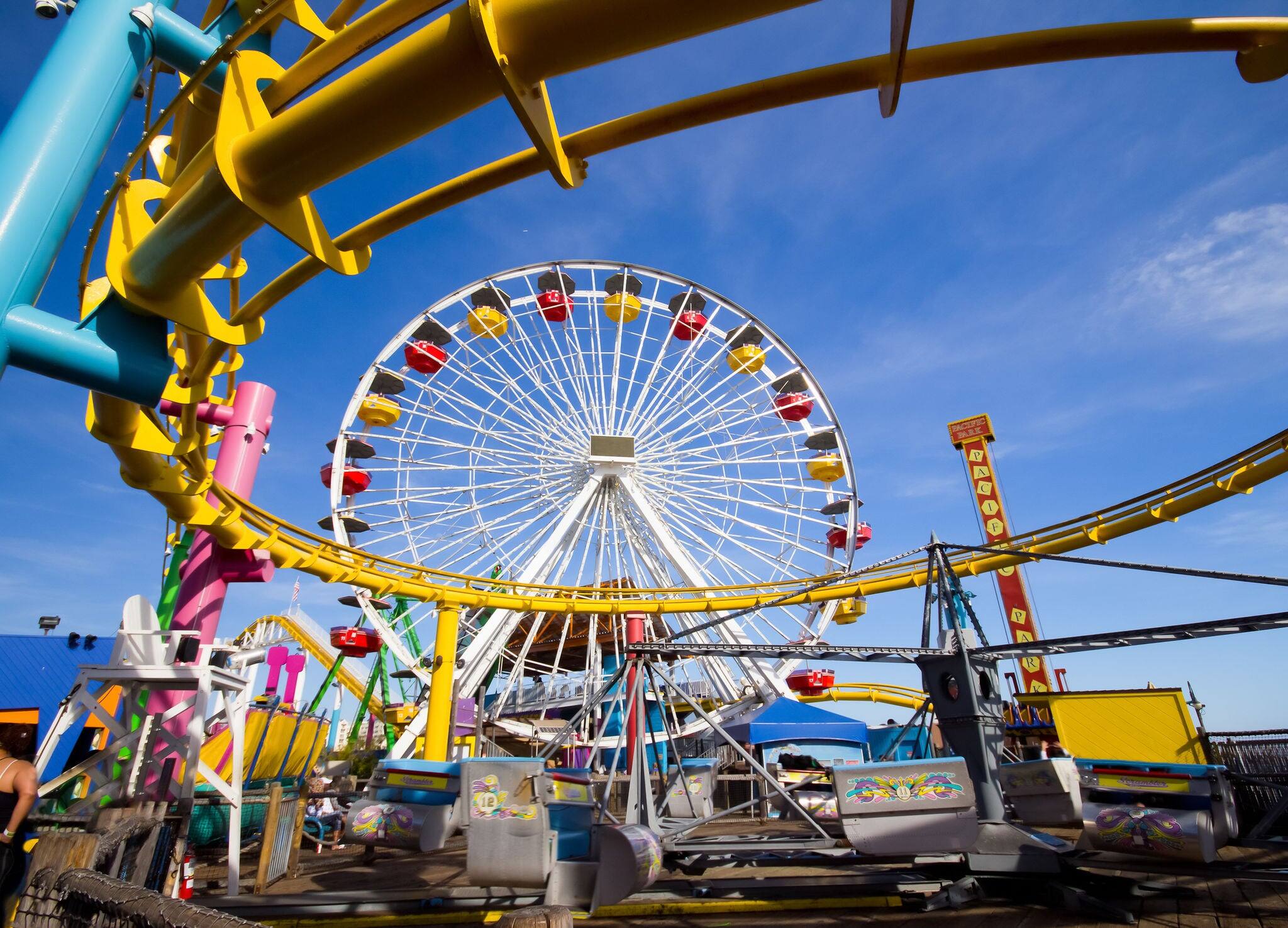 Image of a popular destination; the pier at Santa Monica, CA. with a view of the Ferris Wheel