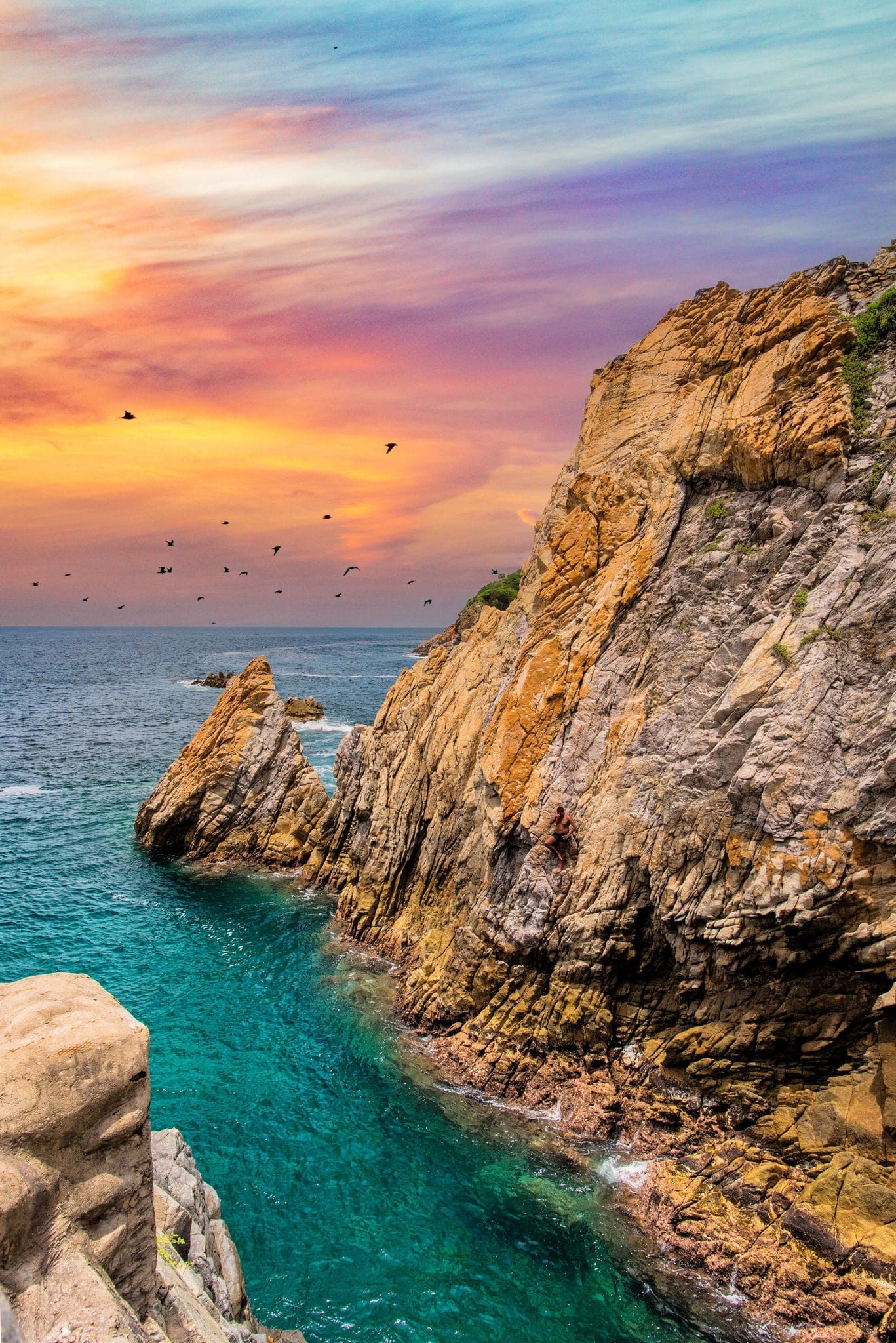 La Quebrada tourist site, famous in Acapulco, sunset in La Quebrada, with warm colors and a turquoise sea