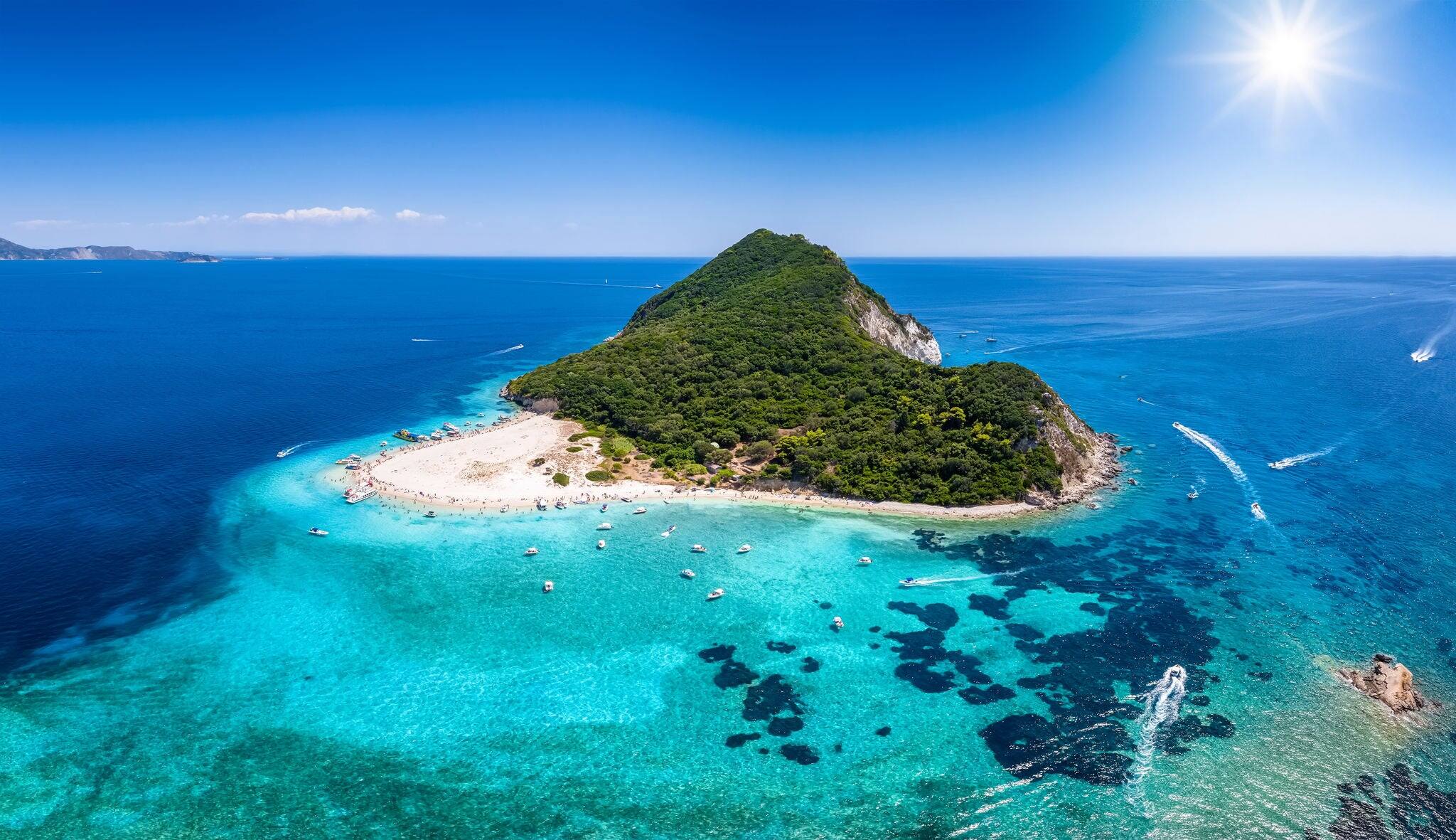 The beautiful island of Marathonisi or Turtle island in the bay of Laganas with turquoise sea and sand beaches, Zakynthos, Greece