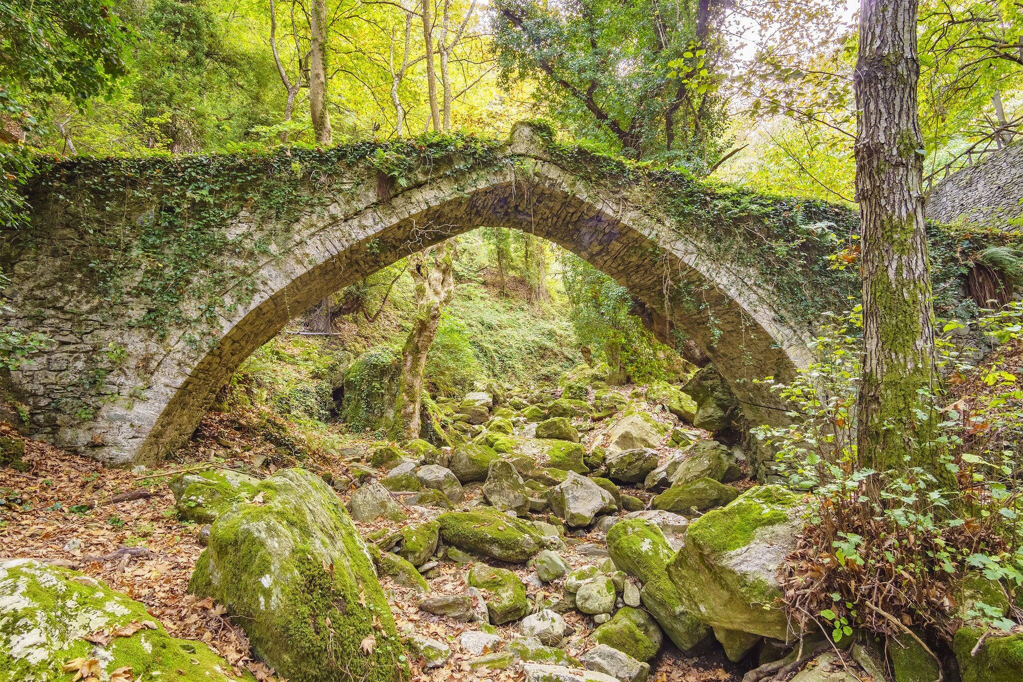 Old arched stoned bridge in Tsagarada and one of the most beautiful sightseeing of Pelion mountain. Magnesia - Greece