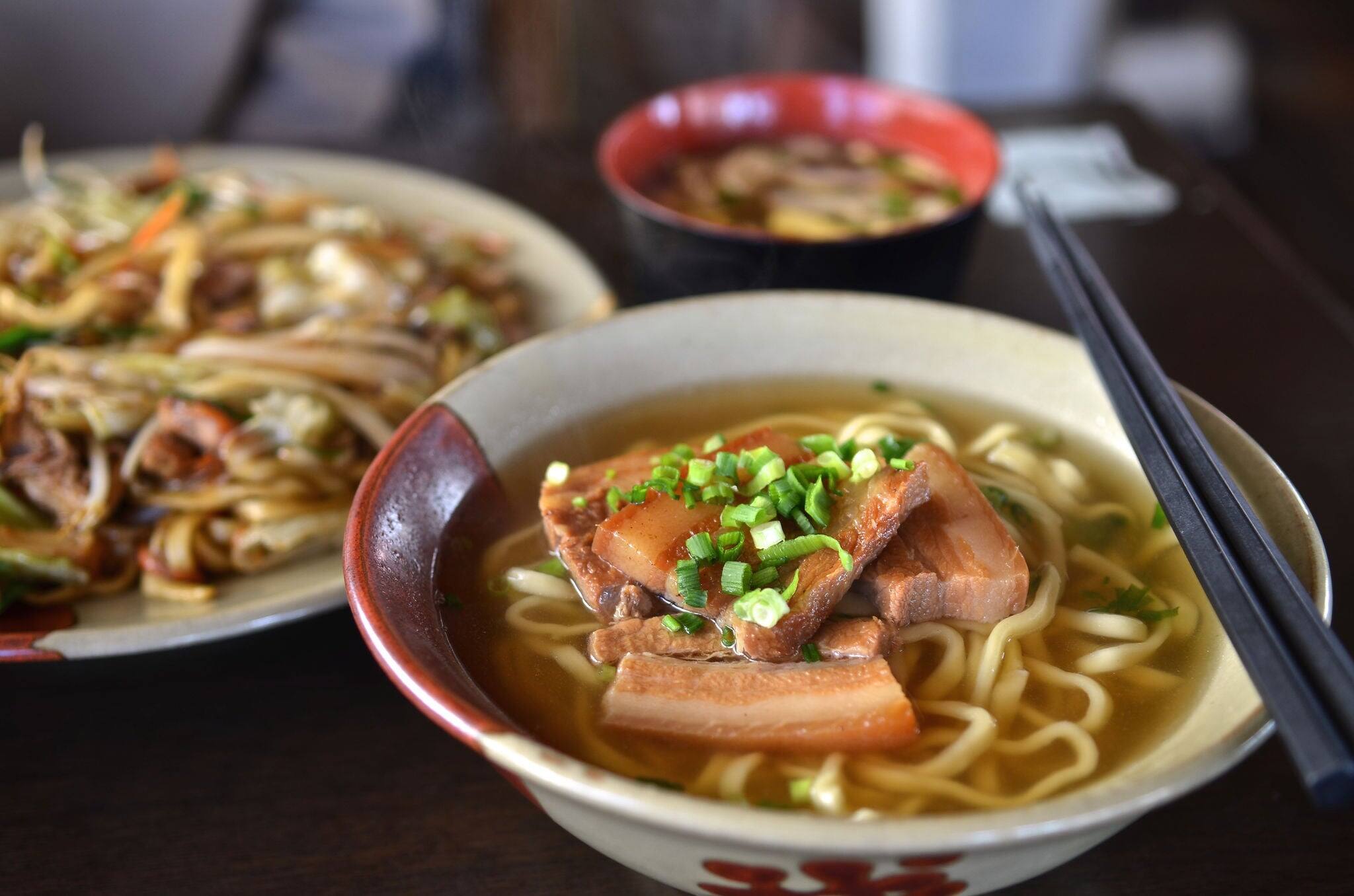 Okinawa Soba noodles with pork soft bone broth. Fire noodles and Japanese soup.