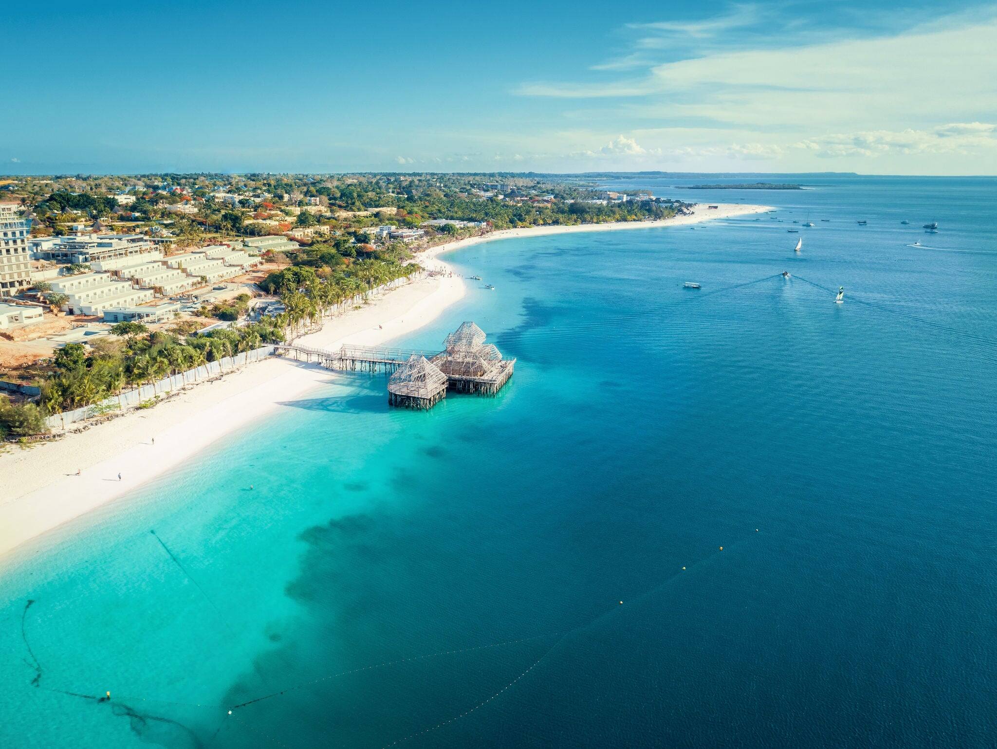 Aerial view of Kendwa beach in Zanzibar, Tanzania with luxury resort and turquoise ocean water. Toned image.