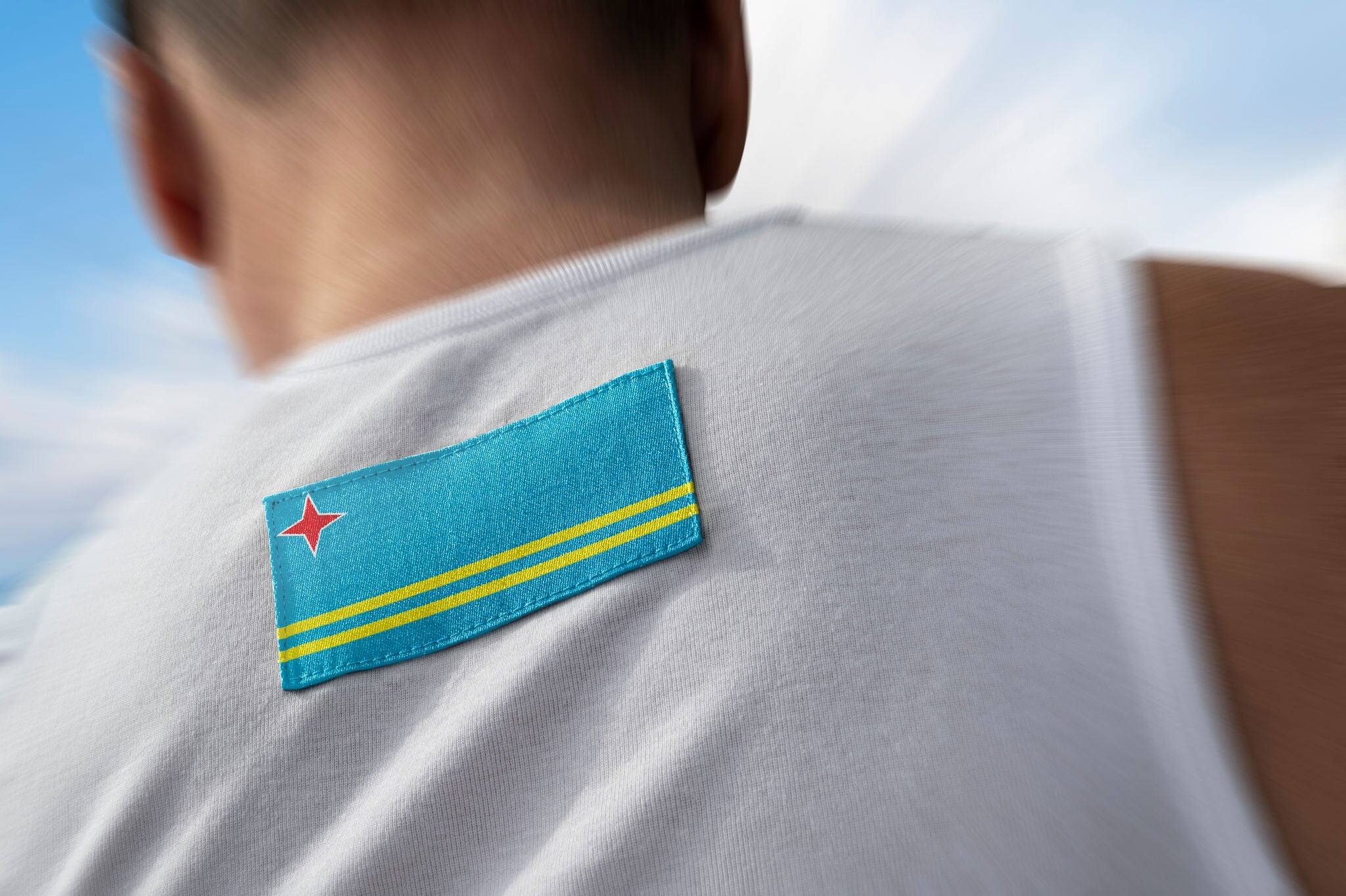 The national flag of Aruba on the athlete's back