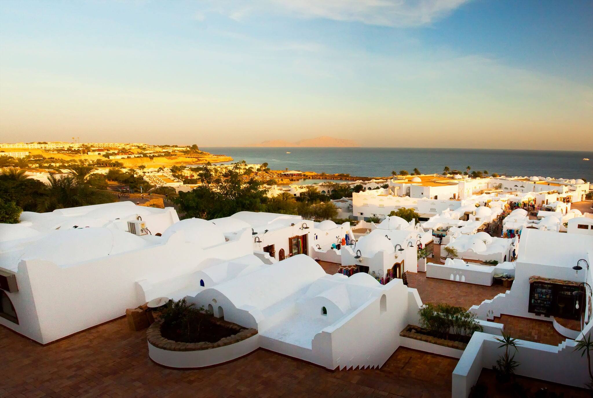 Panorama of the coast of Egypt to the white city (Sharm el Sheikh) in a morning sunrise