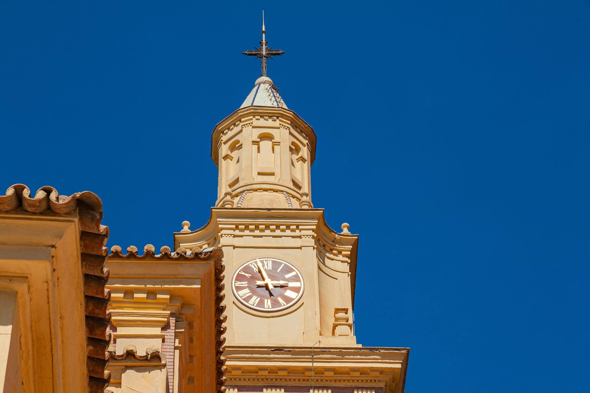 Sanctuary of Our Lady of the Head in Motril, Spain, against a blue sky.
