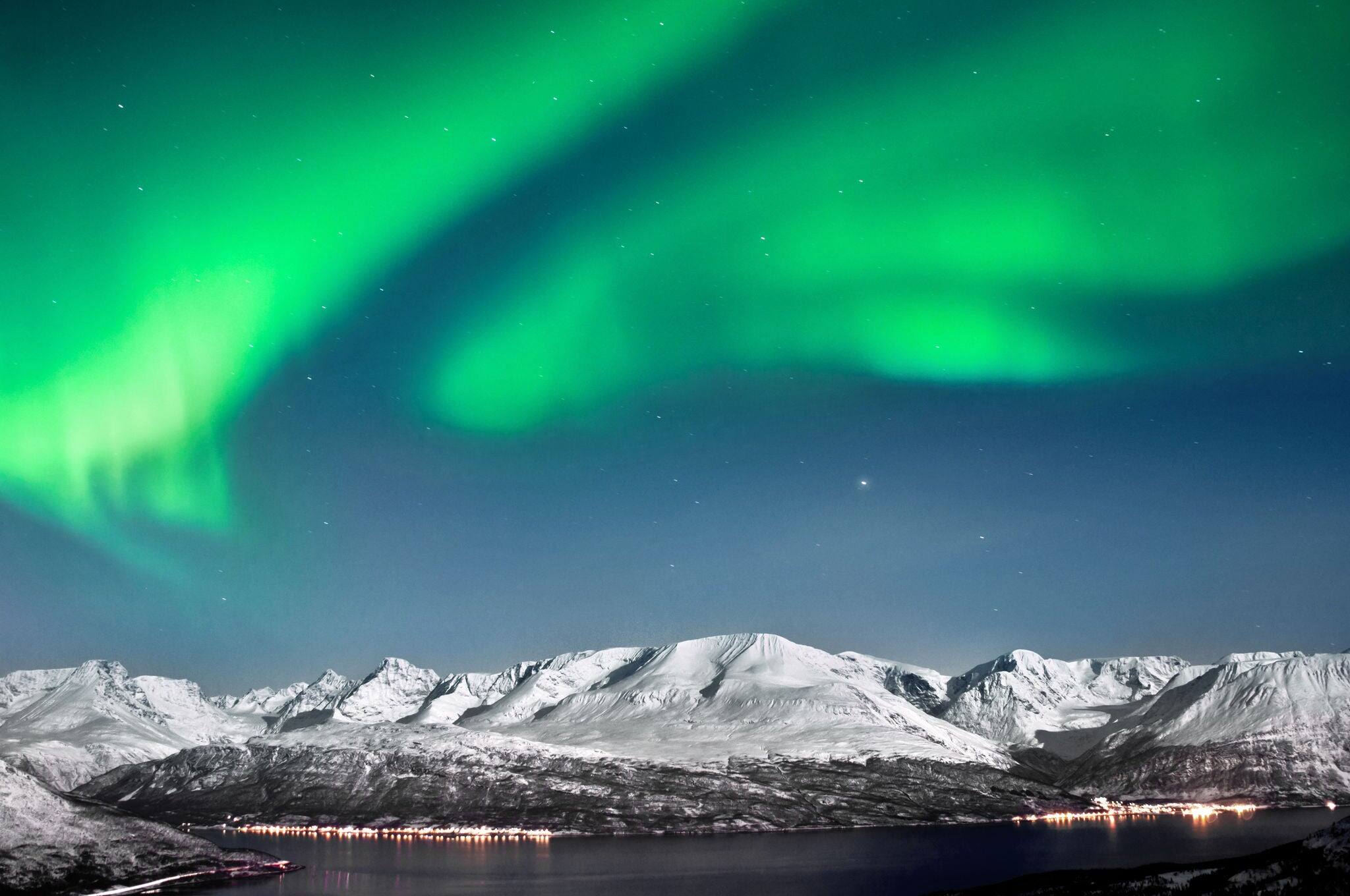 Beautiful Aurora above fjords near Skibotn, Norway