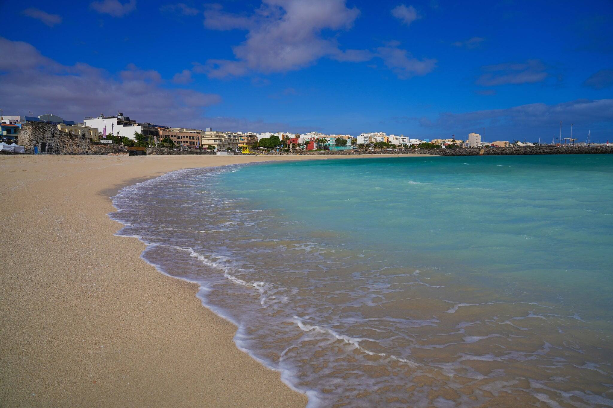 Residential buildings by the Atlantic Ocean in Puerto del Rosario, as seen from Playa Chica ("Chica Beach") in the capital of Fuerteventura island in the Canary Islands, Spain