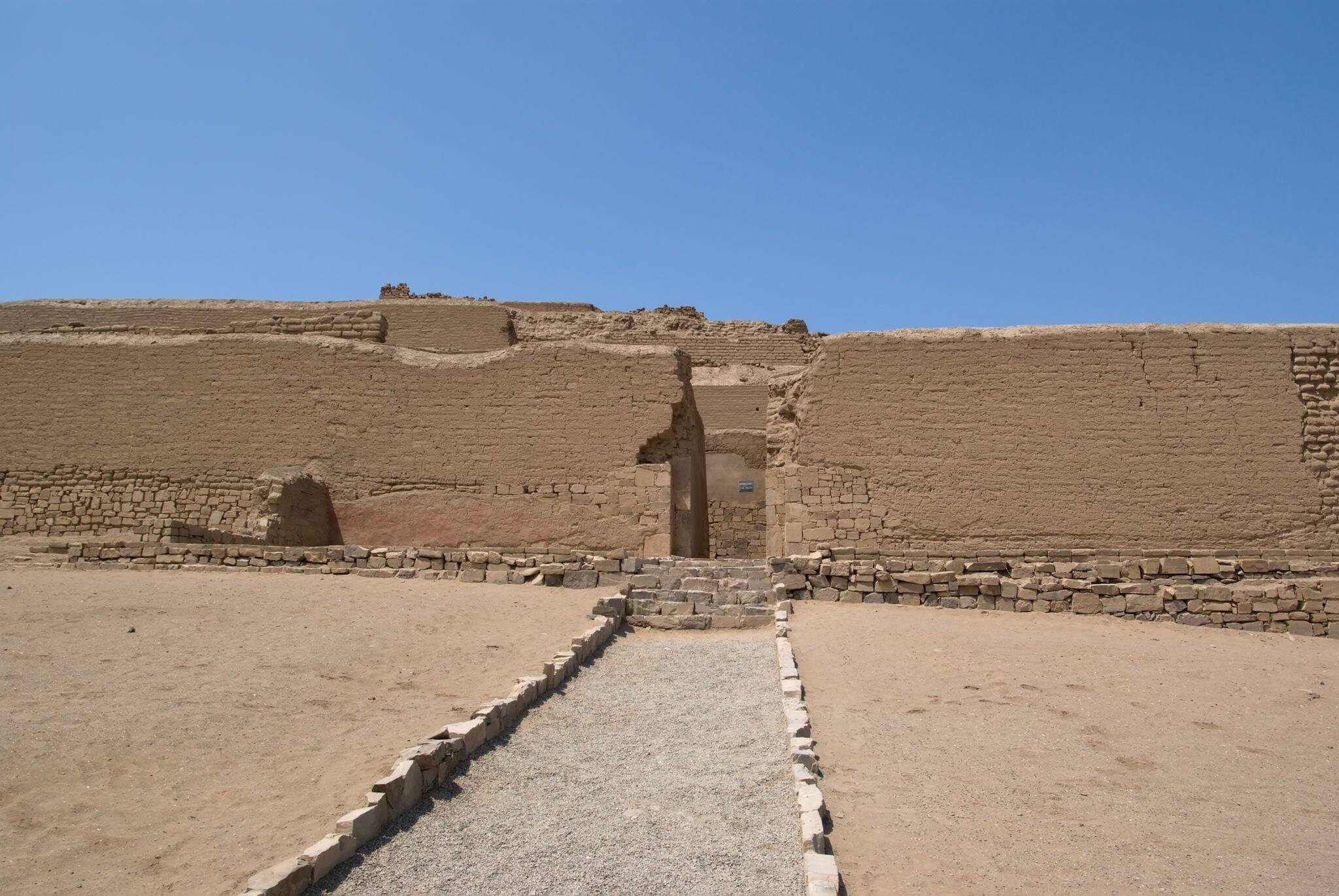 The spectacular Incan Temple of the Sun in Pachacamac, located at the top of a rocky promontory, overlooking the Pacific ocean, is made of four pyramid bodies truncated to superimpose one another.