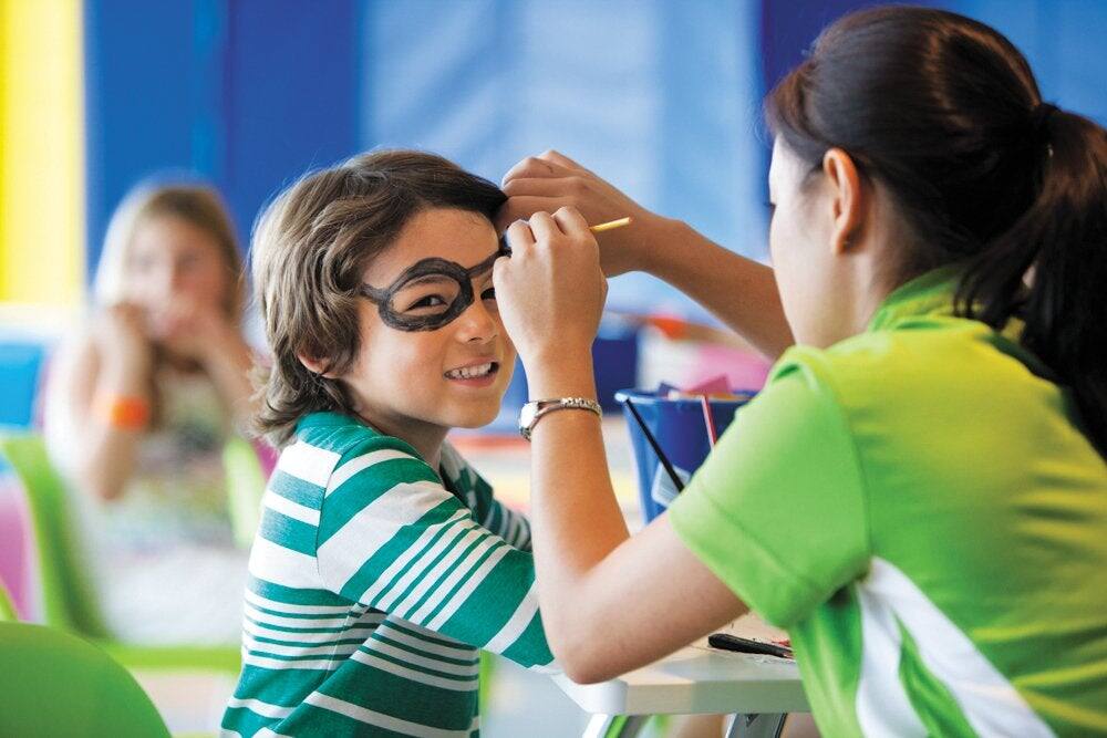 Boy getting pirate face paint