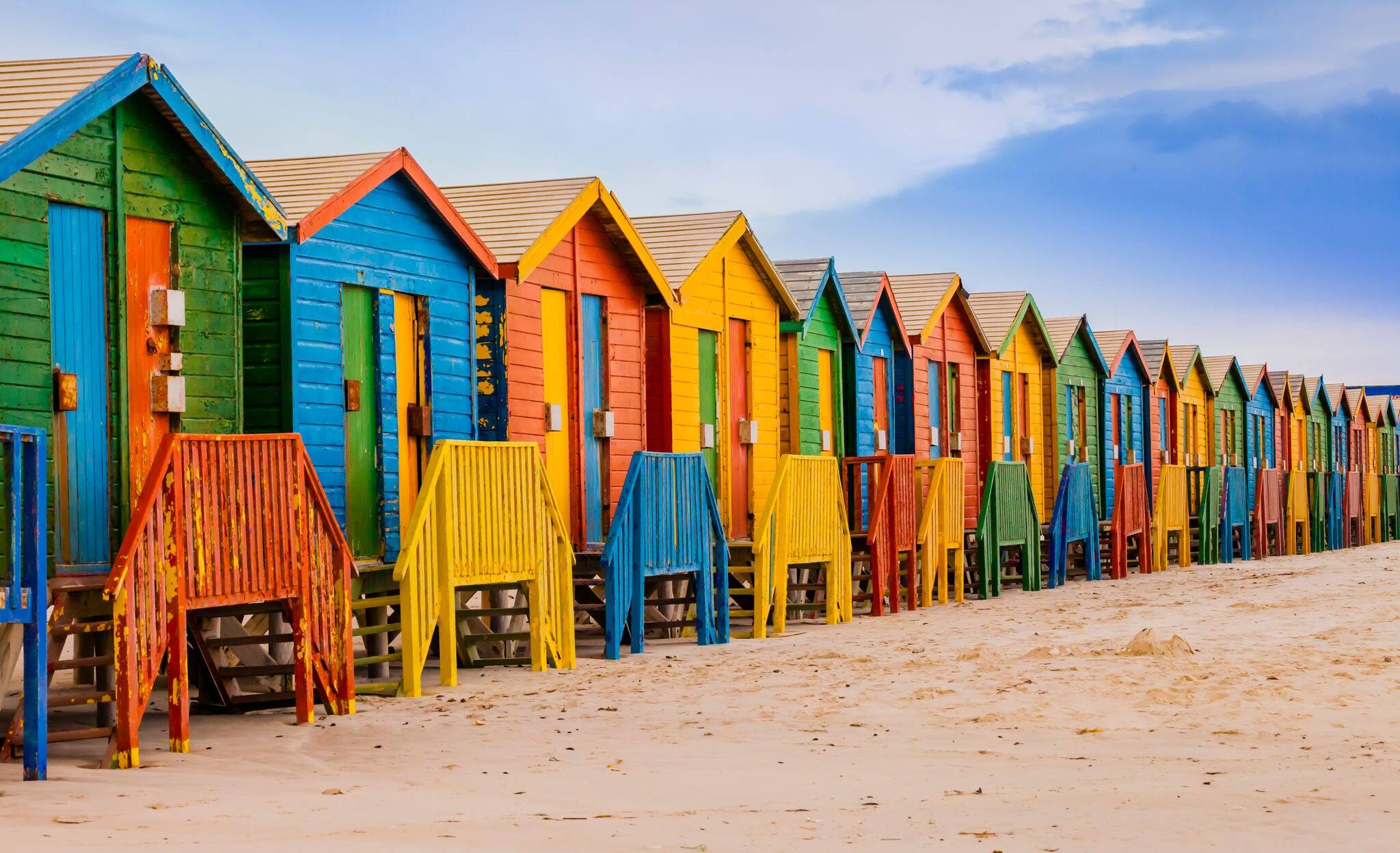 Row of colorful bathing huts in Muizenberg beach, Cape Town, South Africa