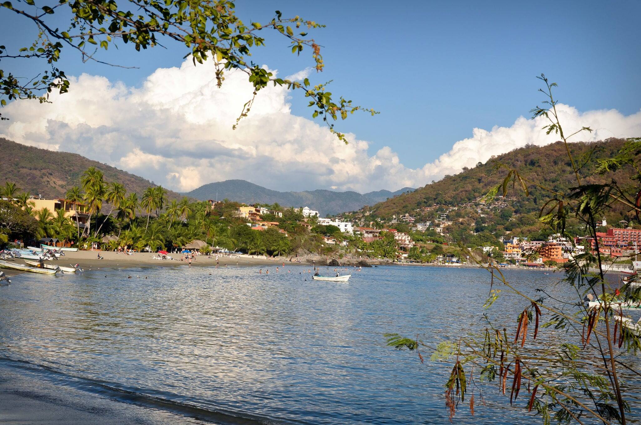 Beautiful Sandy Beach in Mexico with clouds in background