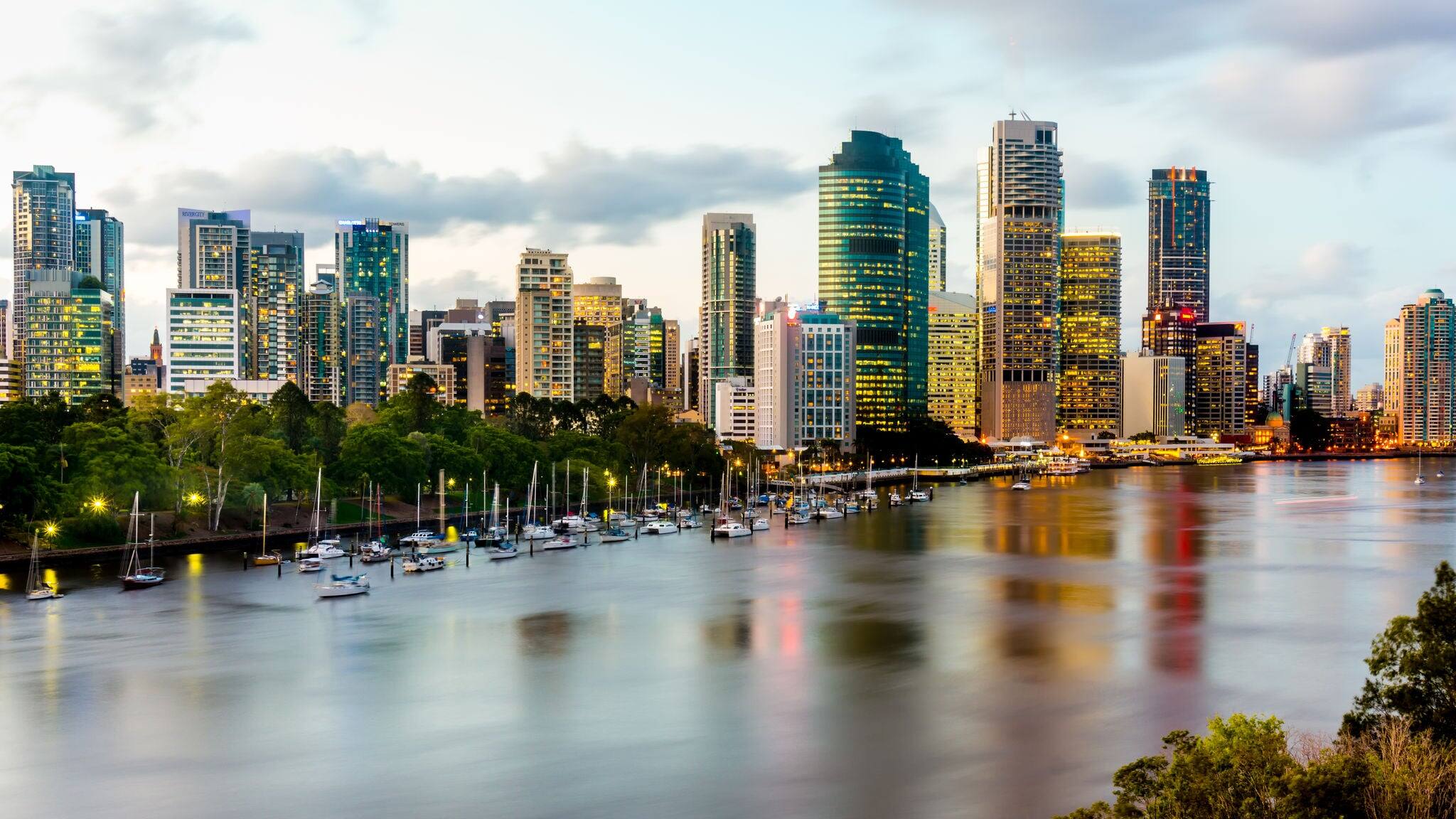 Scenic view of Brisbane River and Cityscape from Kangaroo Point Cliffs late afternoon. HDR image.
